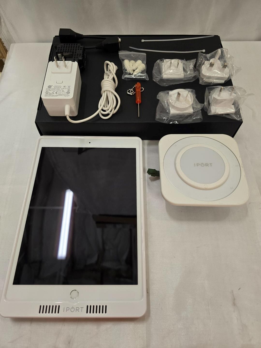Apple iPad 7th Gen 32GB with iPort LaunchPort Wall Station and White Sleeve